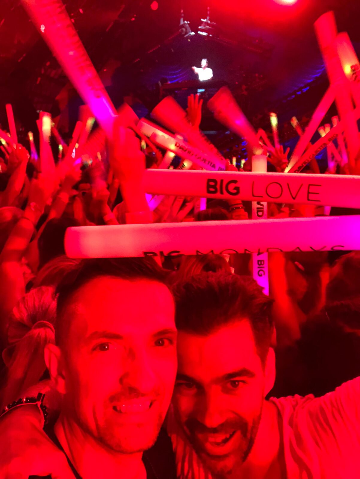 Crowd at a DJ event in Barcelona under red lights